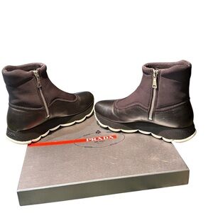 Prada women’s Black ankle boots with White Soles